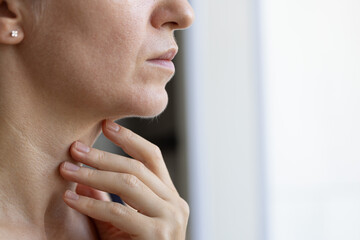 Woman with hair on her face. Unwanted hair on female chin. Closeup.