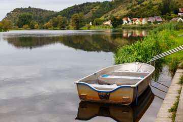 iron boat in the river against the backdrop of hills and German architecture. Bavaria, Kalm nz