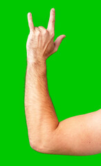 human arm gesturing with raised fingers against a bright green backdrop