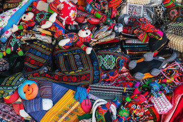 Colorful bags and various textiles on the counter at the market in Vietnam in Asia