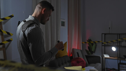 Hispanic man investigating crime scene in modern apartment living room