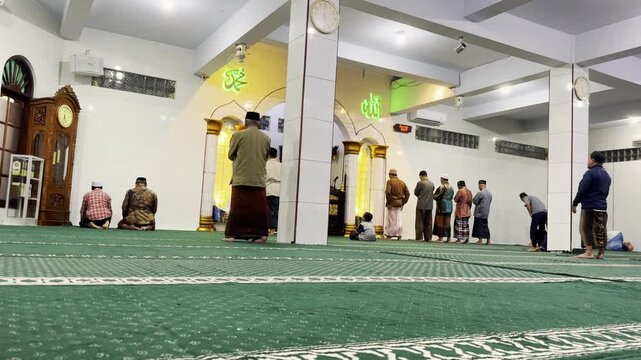 Tabanan, Indonesia - November 2024 : Maghrib prayer atmosphere in the mosque. people, people, religion, islam, islamic background concept