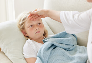 Mother, child and feeling for symptoms, fever and cold virus in living room with concern or care....