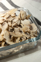 Frozen food sliced mushrooms champignon homemade. Harvesting concept. Stocking up vegetables for winter storage