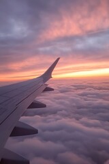 Obraz premium Airplane Wing Flying Above Clouds