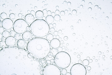 Soda bubbles and macro water,collection water bubble black oxygen air, in underwater clear liquid with bubbles flowing up on the water surface, isolated on a white background