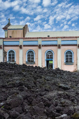 La Reunion, the Notre-Dame-des-Laves church in the village of Sainte-Rose, with the lava around, in the east coast of the island
