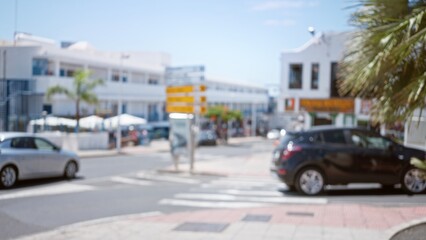 Blurred outdoor scene in lanzarote, canary islands, showing defocused cars and street with bokeh background