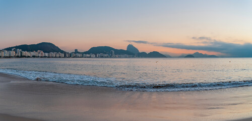 sunrise on Copacabana beach in Rio de Janeiro.