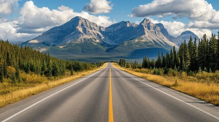 Fototapeta premium Empty asphalt road with a mountainous backdrop