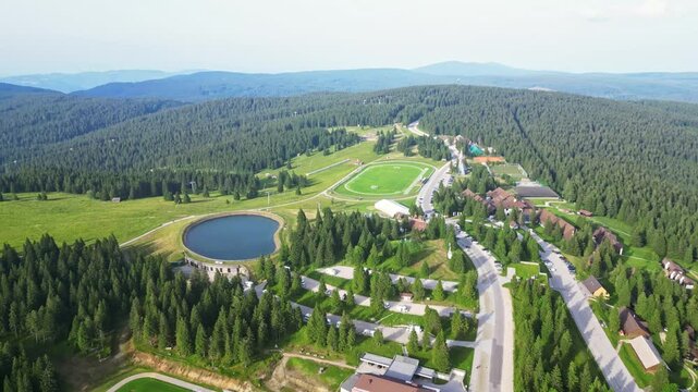 Aerial view of scenic forest and tranquil resort in a picturesque valley, Rogla, Slovenia.