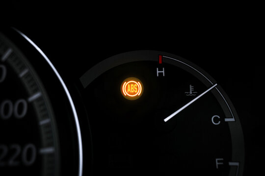Car ABS warning light , Close up of ABS warning light blinking on car dashboard , car repair concept