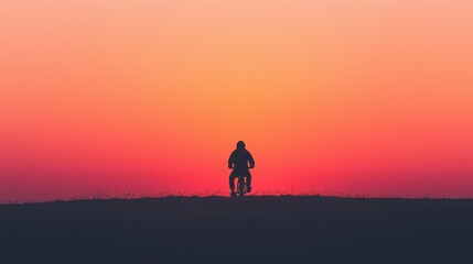 Obraz premium Silhouette of Cyclist Against Vibrant Horizon