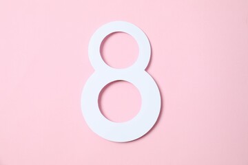 Number 8 on a color background. Minimal Women's day, March 8th or birthday concept. Flat lay, top view.