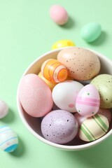 Happy Easter card. Easter eggs and decoration on color background, top view