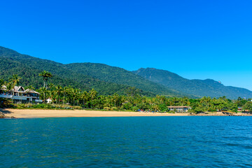 Feiticeira Beach surrounded by forests and the sea on the island of Ilhabela on the north coast of Sao Paulo