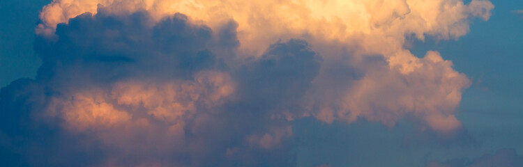 Clouds in the sky are soft gradient yellow, orange and blue. abstract background, wallpaper