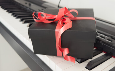 Christmas gift box on piano keys