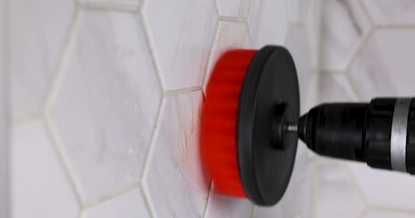 cleaning bathroom tiles with drill brush