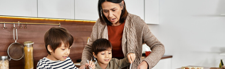 A grandmother delights in baking holiday treats with her two cheerful grandsons, celebrating winter joy together.