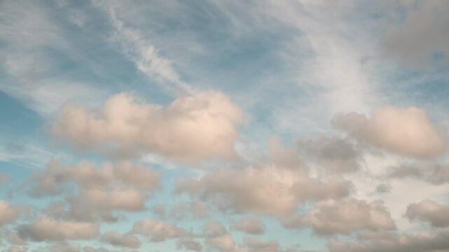 Timelapse of rolling white clouds and blue sky