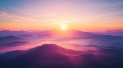 Fototapeta premium Stunning aerial view of sunrise or sunset over misty mountains showcasing a vibrant and colorful natural landscape