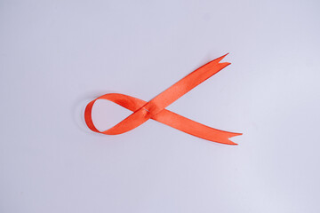 Stethoscope with a red ribbon, symbolizing World AIDS Day