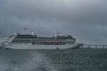 Small luxury cruiseship cruise ship liner Nautica anchoring at sea in bay of Newport, Rhode Island...