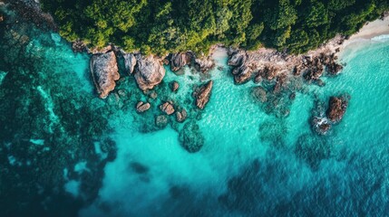Obraz premium Stunning aerial perspective of a coastline featuring crystal clear turquoise waters evoking a sense of summer and holiday relaxation