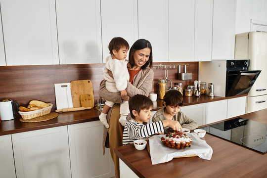 A cheerful family enjoys baking festive goodies together, creating sweet holiday memories in their kitchen. - Powered by Adobe