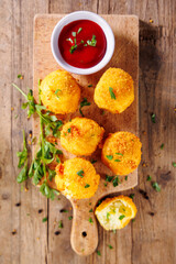 fried potato ball with dipping sauce, aranchini