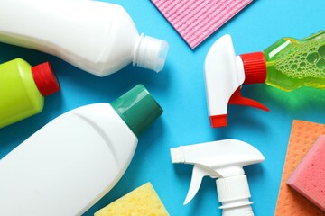 Many different house cleaning products on color background, top view
