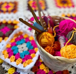 Granny square crocheted blanket with different colors motives, retro vintage craft handmade handiwork crocheting, beautiful plied photo cozy winter or autumn background wool thing yarn lovely warm 