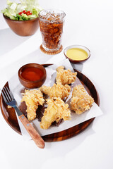 Fried Chicken Drumsticks and Vegetable Salad food on a white background