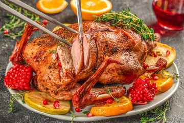 Baked duck with oranges, berries and herbs. Thanksgiving or Christmas dinner. top view