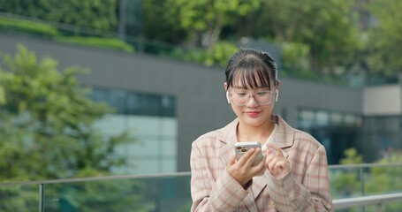 Asian teenage woman using smartphone to shop online. Women make financial transactions, transfer money via bank apps, order products. Businesswoman chatting on mobile phone. communication technology