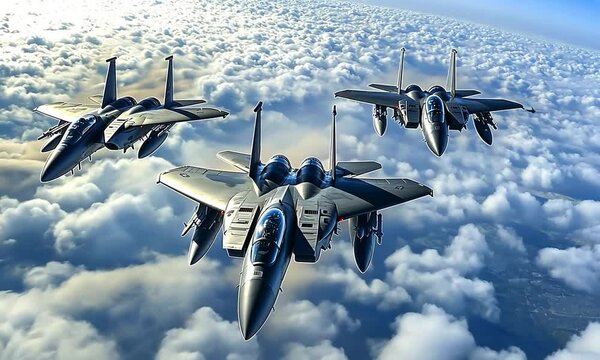 Three F-15 Eagle Fighter Jets Flying in Formation Above Clouds