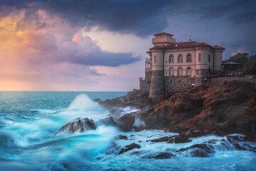 Boccale castle on the rocks and rough sea. Livorno, Tuscany region, Italy