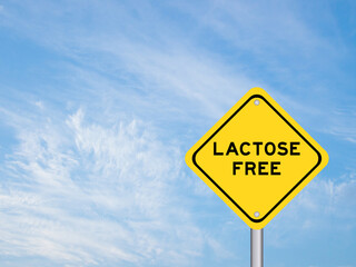 Yellow transportation sign with word lactose free on blue color sky background