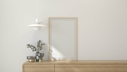 Minimalistic interior featuring a wooden drawer with decorative vases, a pendant lamp, and an empty frame against a soft, neutral background. 3d render