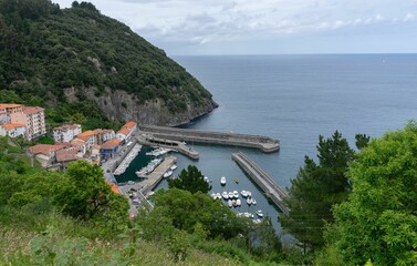Views of the fishing port of Elantxobe surrounded by mountains with the immense Cantabrian Sea.