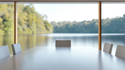Tranquil workspace with expansive windows overlooking a serene lake and lush forest in an empty conference room