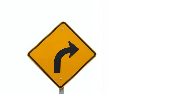 A yellow and black road sign warning of a sharp curve to the right.