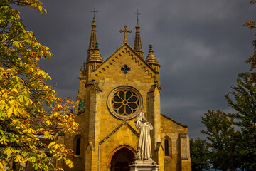 dark clouds behind the ancient cathedral of neuchatel switzerland