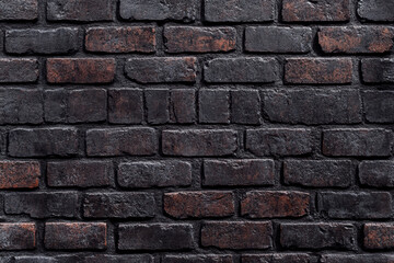 Fototapeta premium A high-resolution texture of weathered, multi-colored bricks is perfect for background use in design projects, adding a touch of history and rustic charm.