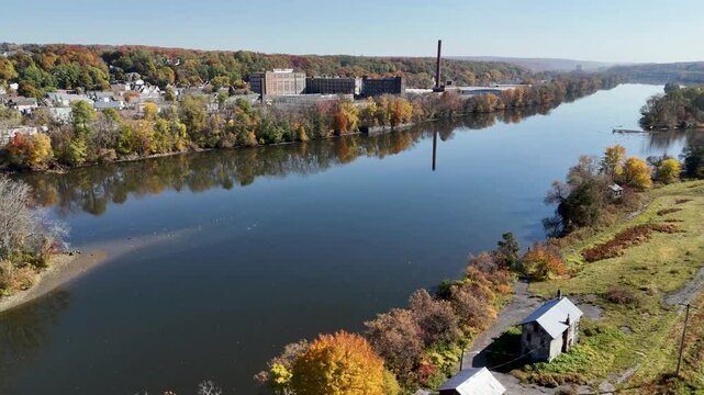 Mohawk river in Amsterdam, New York in Autumn, 4K Aerial Drone Shot