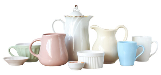 Diverse collection of ceramic tableware in pastel colors, including mugs, teacups, a teapot, and small bowls, is arranged against a white background