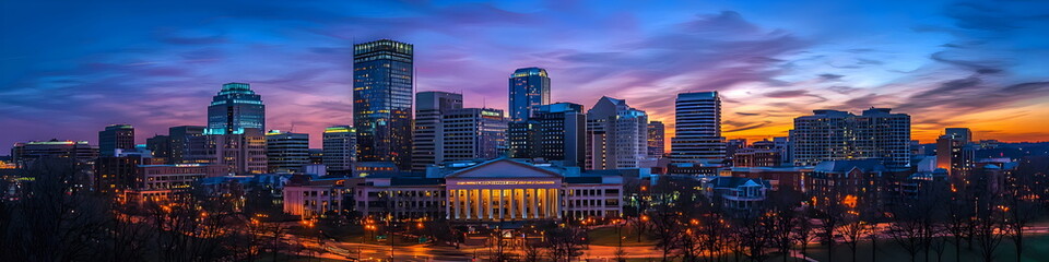 Obraz premium A city skyline at dusk with a large building in the middle