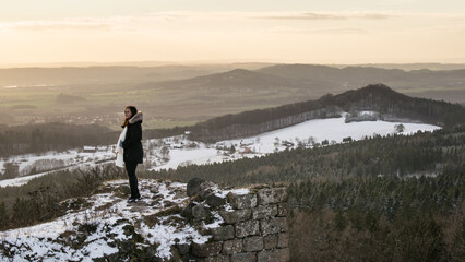 The ruins of Kumburk Castle offer a breathtaking view of the Czech landscape, blanketed in snow.