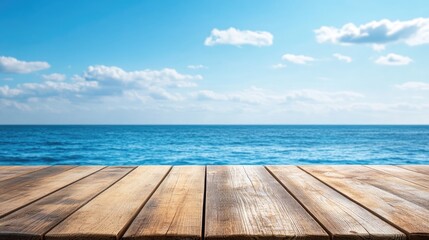 Fototapeta premium Wooden deck table surface with a blurred sea and blue sky backdrop ideal for showcasing or presenting products High quality image